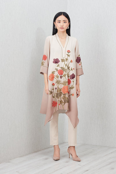 Beige Azara Tunic by Ranna Gill with floral embroidery, V-neckline, 3/4 sleeves, and handkerchief hem.