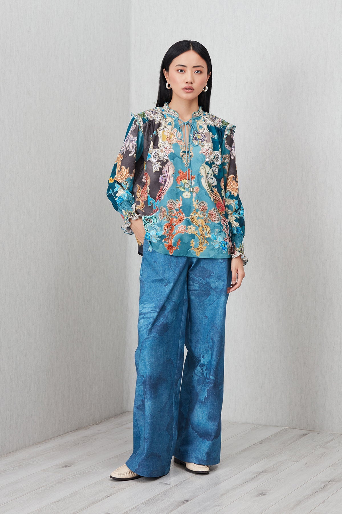Ranna Gill Venari Neck Tie Blouse in Poly Crinkle Baroque print with tie-up neckline and gathered cuffs.
