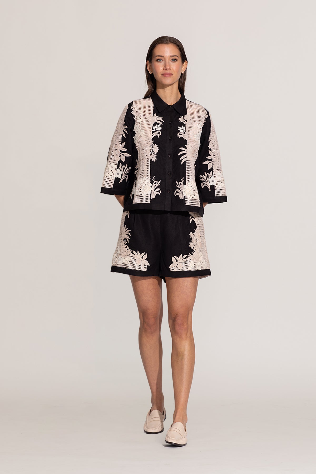 Ranna Gill Alice black relaxed-fit shirt with ivory floral embroidery.