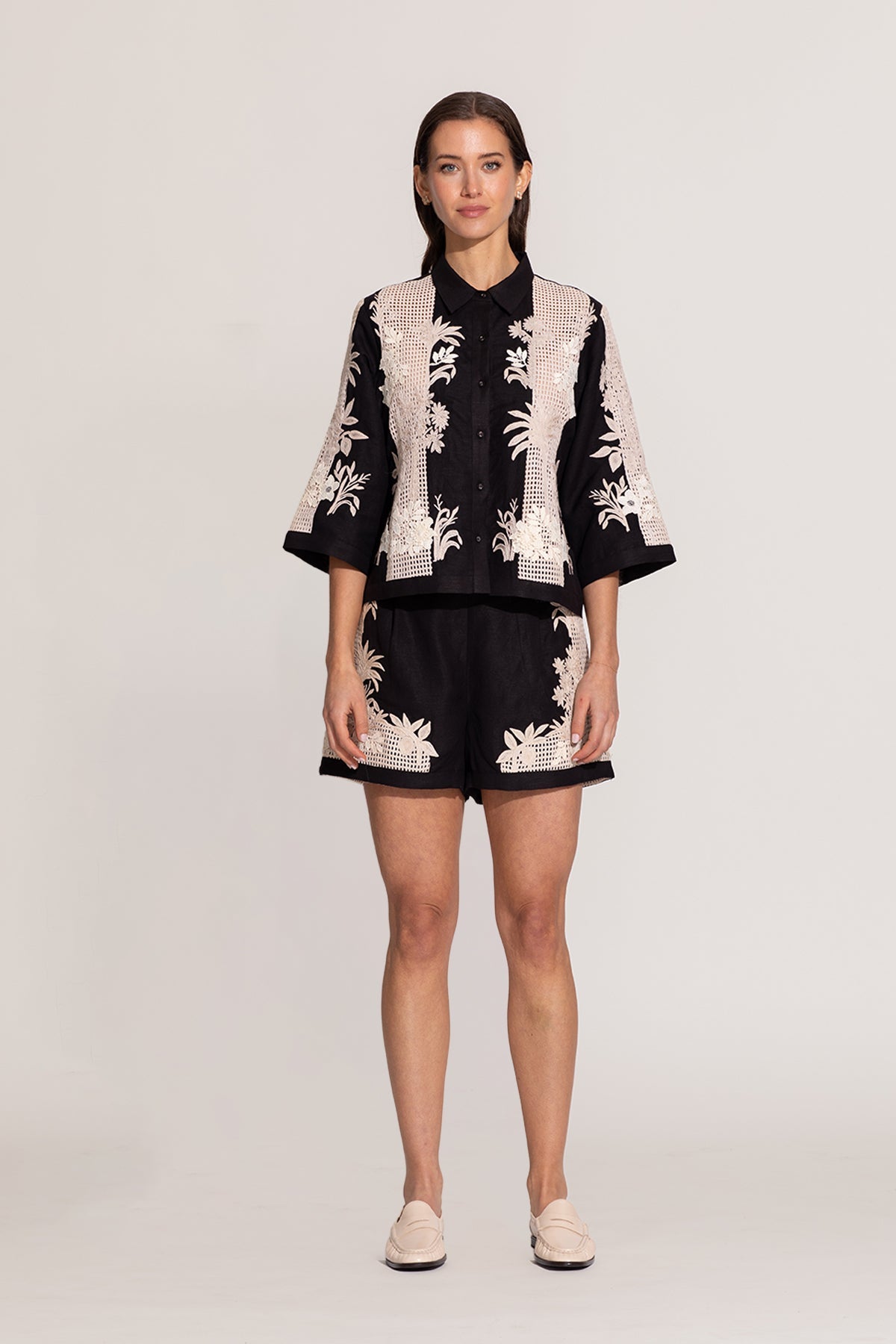 Ranna Gill Alice black relaxed-fit shirt with ivory floral embroidery.