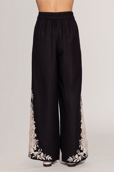 Ranna Gill Khloe black palazzo pants with ivory white floral embroidery. 