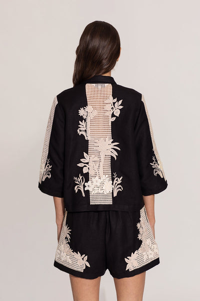 Ranna Gill Alice black relaxed-fit shirt with ivory floral embroidery.