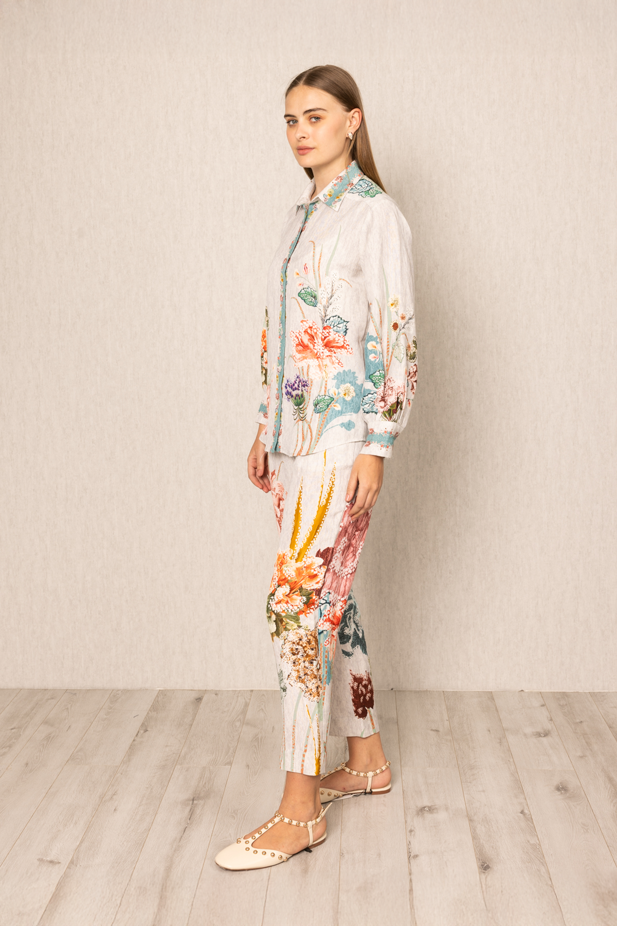 Ranna Gill Bora Co-ord Set in White linen with Floral buttondown shirt and tailored pants.