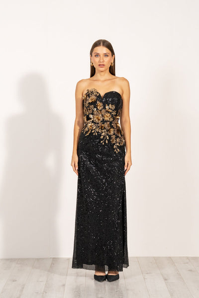 Aleysa Dress by Ranna Gill a black long dress with gold sequins and a thigh-high slit on the left side.