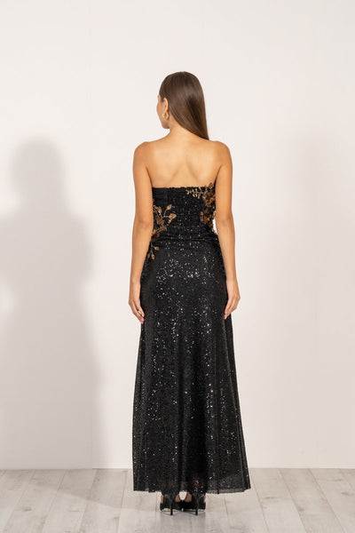 Aleysa Dress by Ranna Gill a black long dress with gold sequins and a thigh-high slit on the left side.