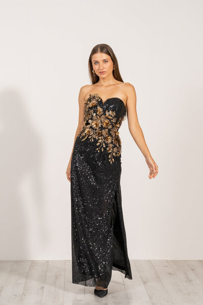 Aleysa Dress by Ranna Gill a black long dress with gold sequins and a thigh-high slit on the left side.